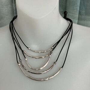 Vintage Chicos Necklace 5 Strand
With Silver Toned Curves On Black Leather Cords